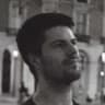 A grainy, monochrome photo of Alex Terenda