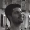 A grainy, monochrome photo of Alex Terenda